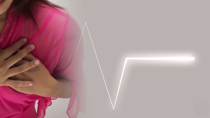 A Woman Clutching Her Chest with A Heartbeat Line Beside Her, Symbolizing Survival After Major Heart Attacks