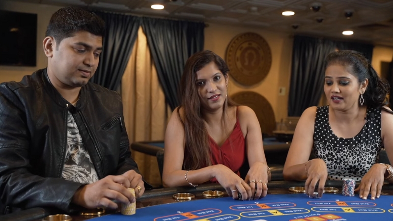 Three People Enjoying a Game at A Casino Table in Goa