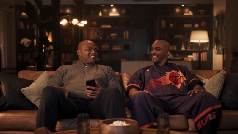 Charles Barkley Sitting on A Couch with A Friend