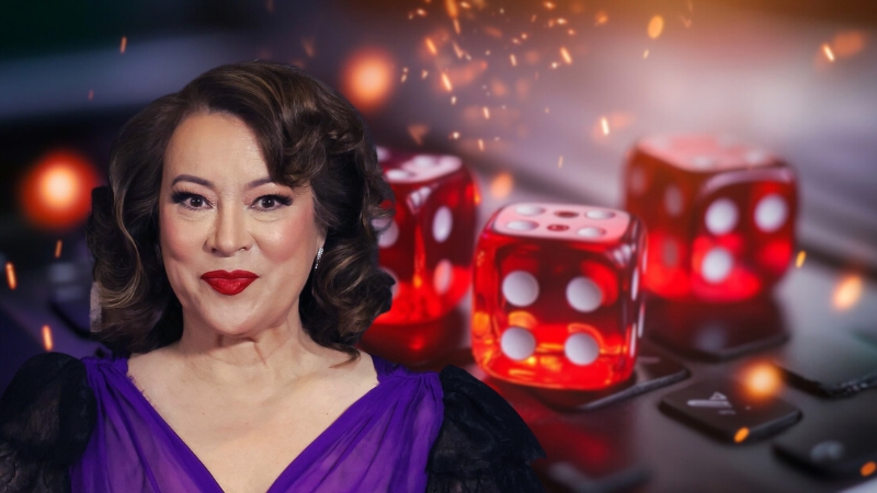 Jennifer Tilly in A Purple Dress with Red Dice in The Background