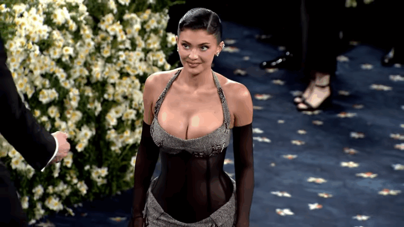 Kylie Jenner wearing a sheer corset gown with tailored herringbone details at the Met Gala 2025