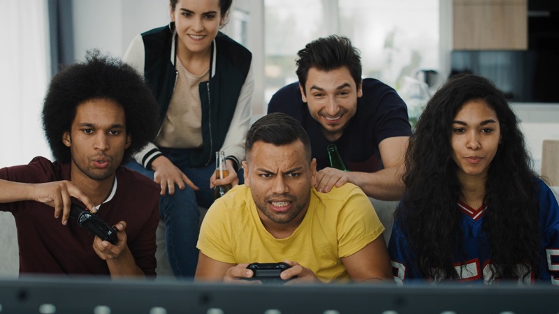 Group of friends playing a video game together