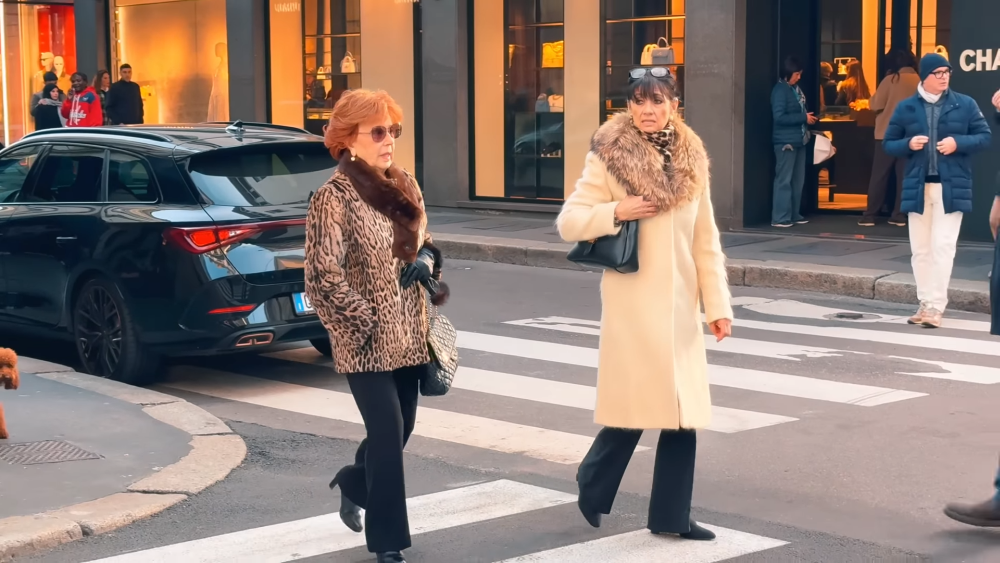 Two women wearing real fur coats — once trendy, now a controversial and taboo fashion choice.