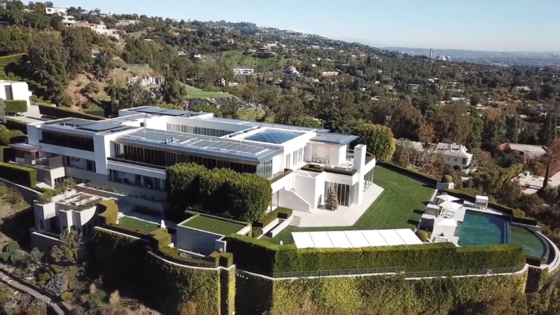 Anthony Pritzker’s Grand Hyatt Bel-Air estate sits on a hilltop with wide lawns, sharp angles, and a large backyard pool