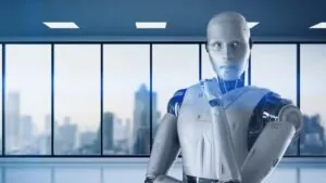 A humanoid robot stands in a modern office, symbolizing how AI will reshape workplaces
