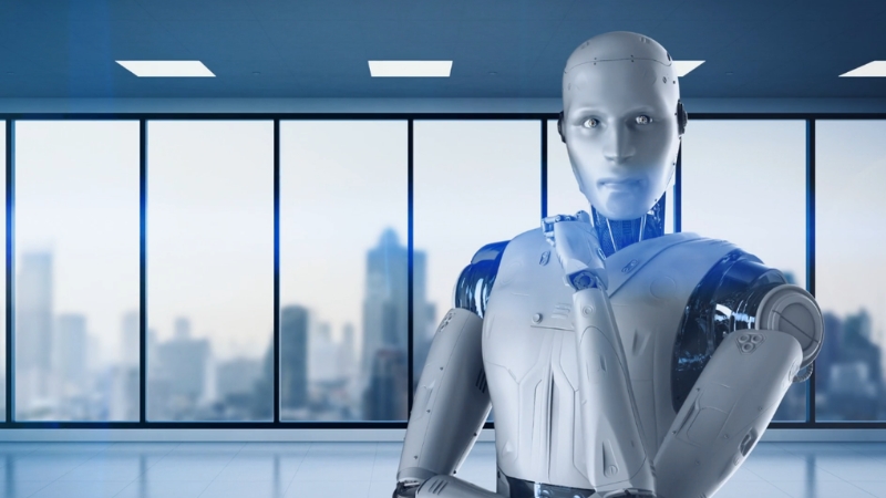 A humanoid robot stands in a modern office, symbolizing how AI will reshape workplaces