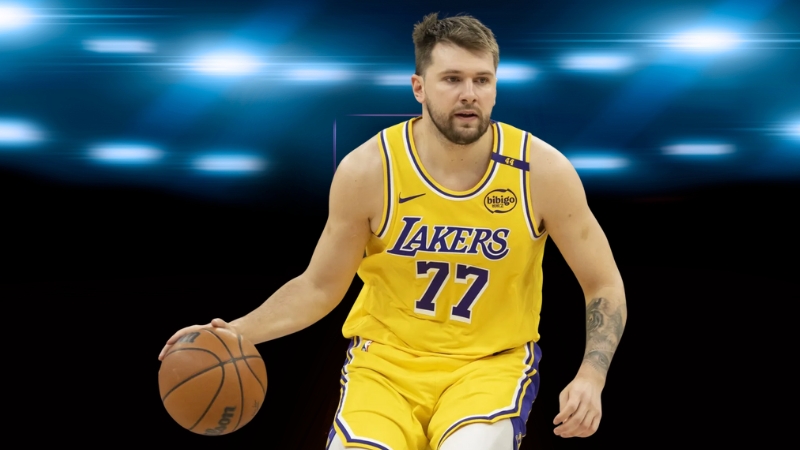 Luka Dončić in a Los Angeles Lakers jersey dribbles the basketball