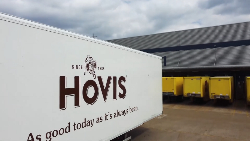 A Hovis delivery truck parked outside a distribution center highlights the company’s role in the UK bread industry