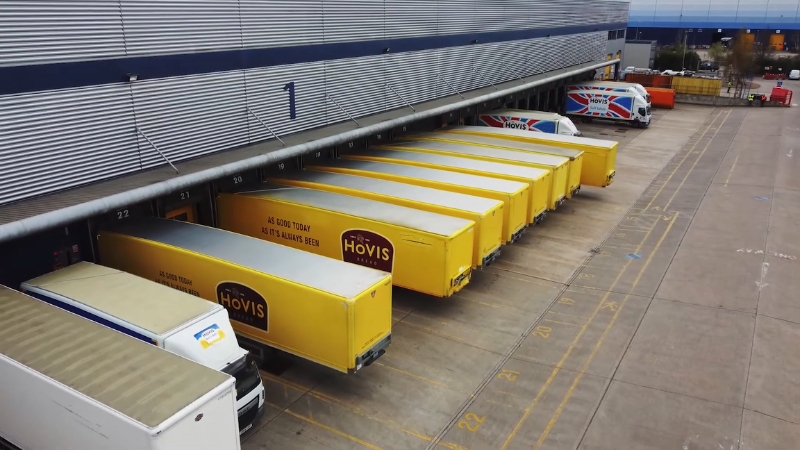 Hovis delivery trucks lined up at a distribution center show the company’s long-standing presence in the UK bread market