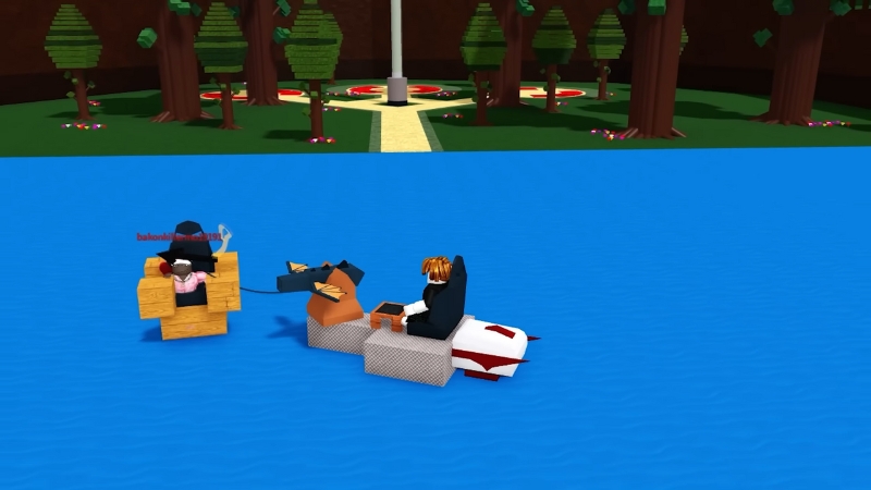 Roblox players ride homemade boats across blue water toward a forested island