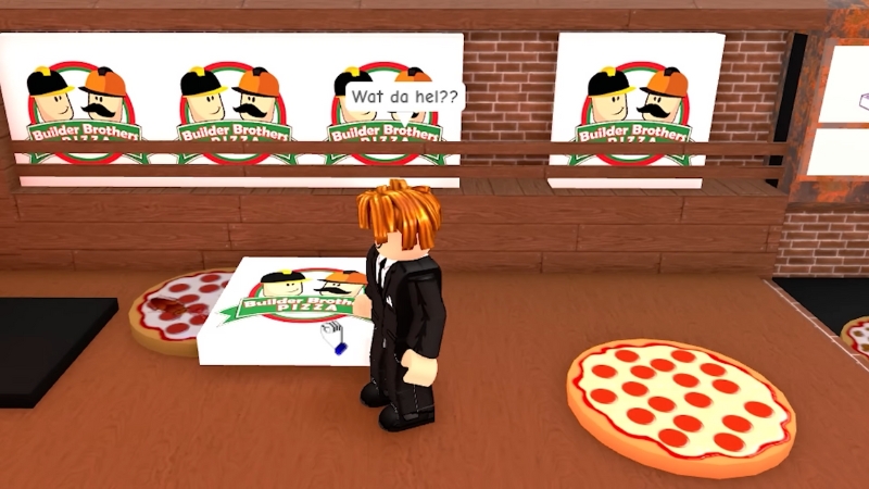 A Roblox worker stands by pizza boxes and toppings inside a busy pizza shop