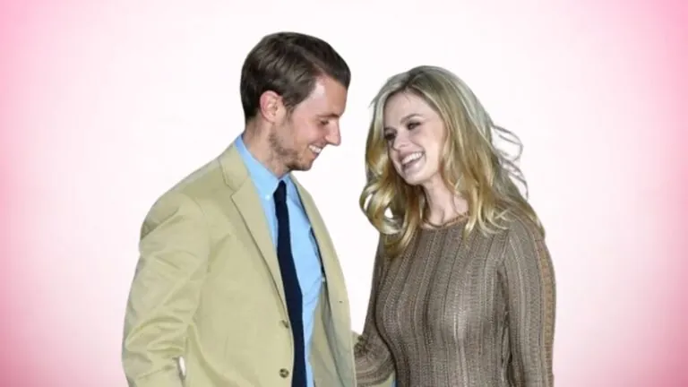 Alex Cowper-Smith stands with Alice Eve and shares a warm moment at a public event