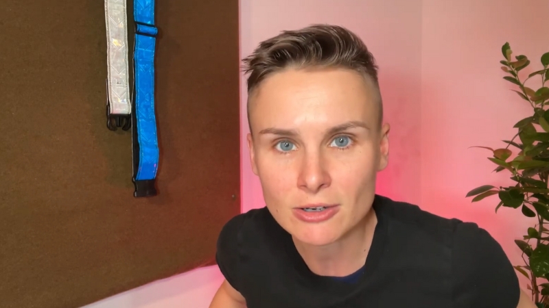 Ashley Gutermuth speaks directly to the camera in a casual black shirt