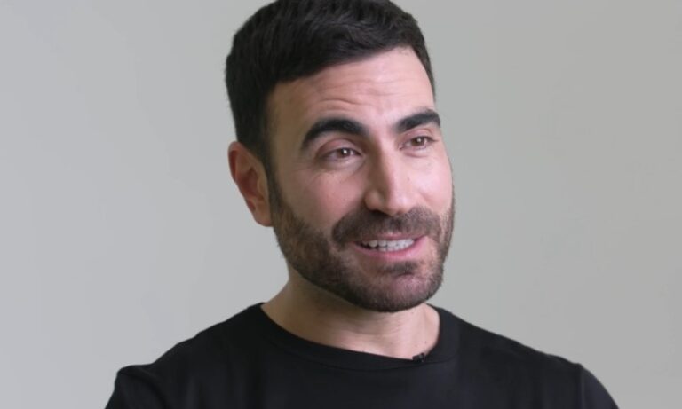 Brett Goldstein smiling at the camera during an interview