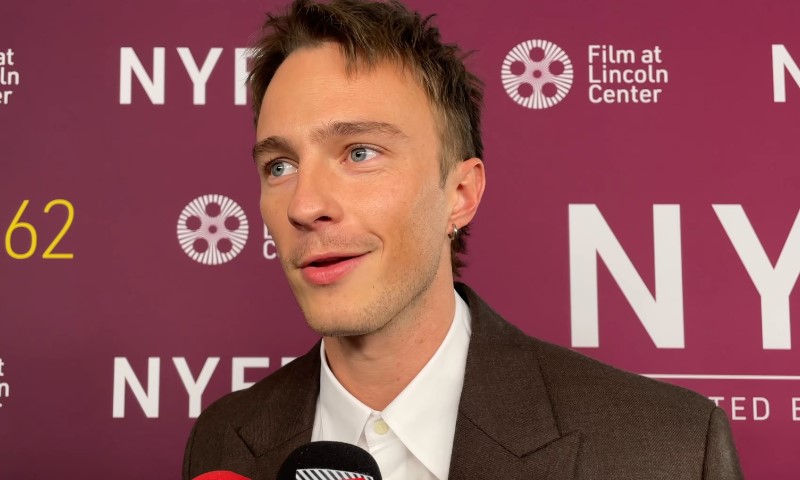 Drew Starkey speaks to a reporter during an interview