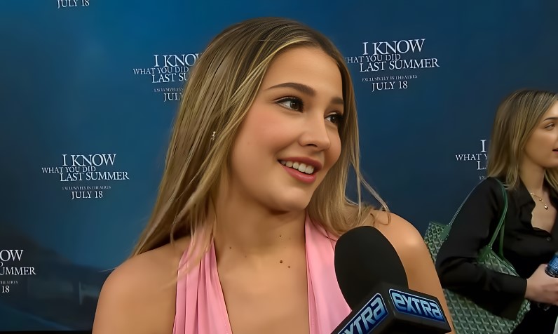 Madelyn Cline gives an interview on a red carpet