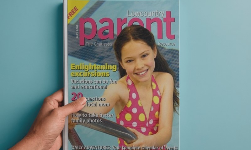 A hand holds a magazine featuring Madelyn Cline on the cover of Parent Magazine