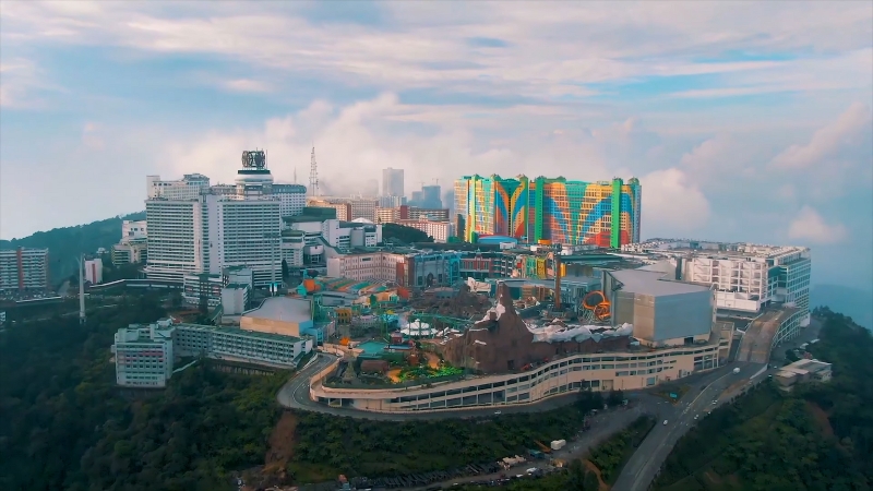 An aerial view of Resorts World Genting showing hotels, theme park areas, and mountain surroundings