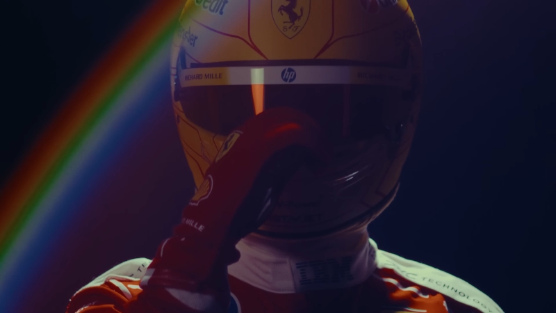 Formula 1 driver adjusting helmet under dramatic lighting ahead of the 2026 season opener