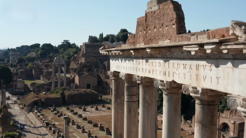 Ancient Roman ruins and temple columns visible across the archaeological site of the Roman Forum in Rome