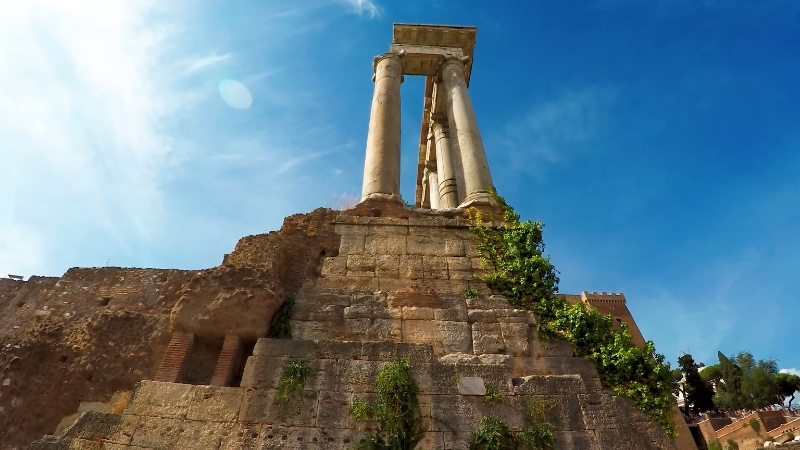 Ancient columns and ruins of the Roman Forum rising above stone foundations in central Rome