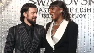 Andrea Preti and Venus Williams smile together at a formal event