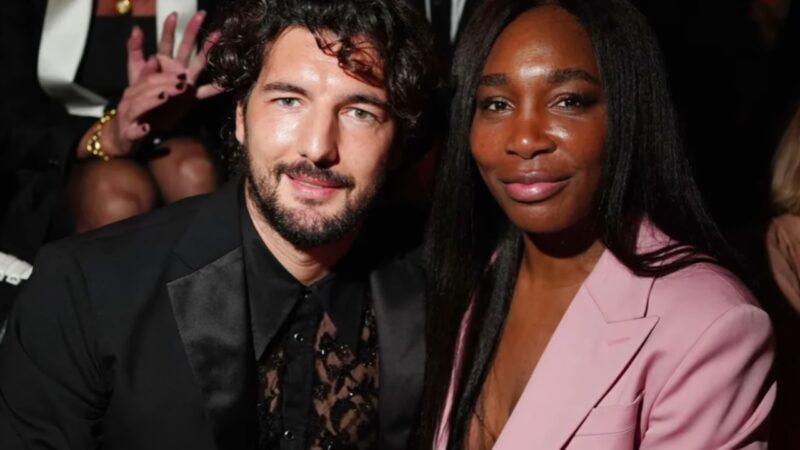 Andrea Preti and Venus Williams sit together at a fashion event