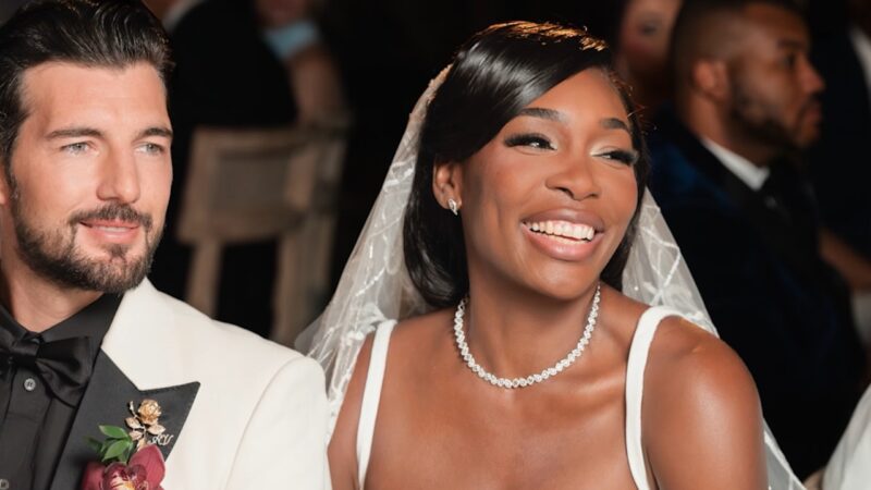 Venus Williams smiles beside Andrea Preti during their wedding celebration
