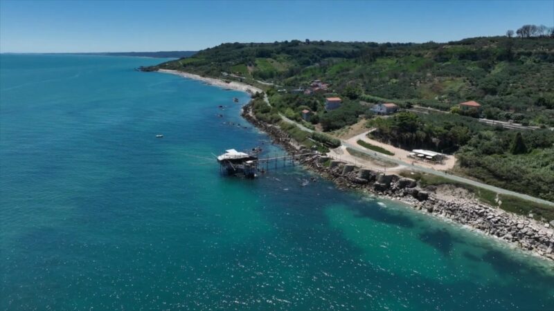 Abruzzo coast with clear Adriatic water and a traditional trabocco.